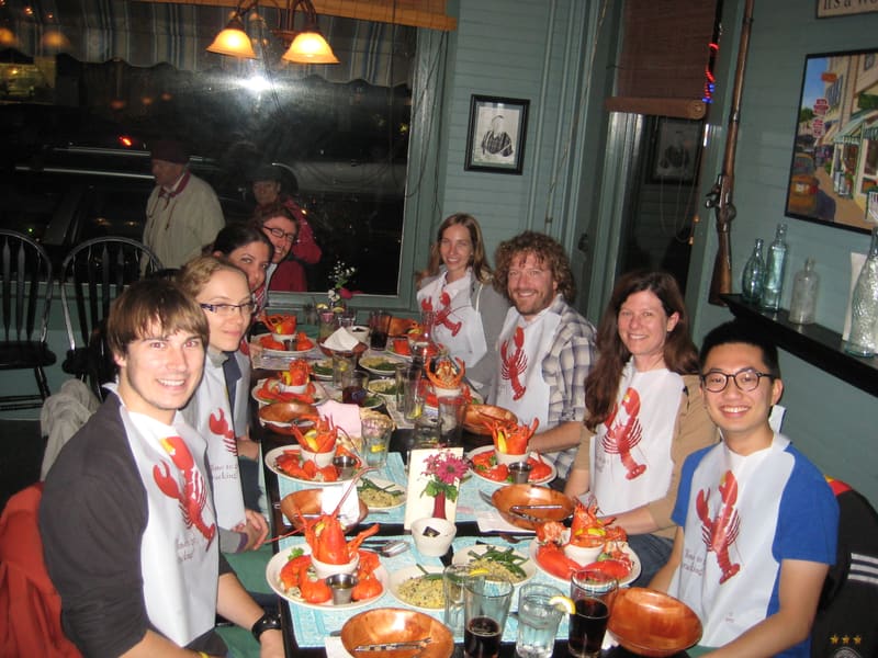 The lab gathered around the table for a lobster dinner
