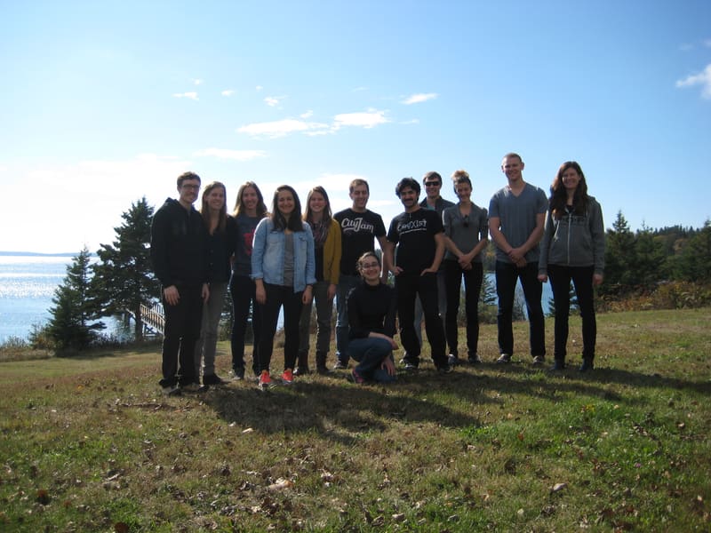 Churchman Lab group portrait outside the retreat house on the Maine coast