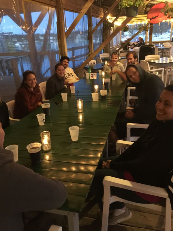 Lab members gathered around the dinner table