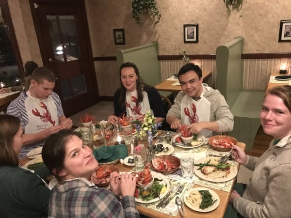 Lab members sharing a lobster dinner at the retreat house