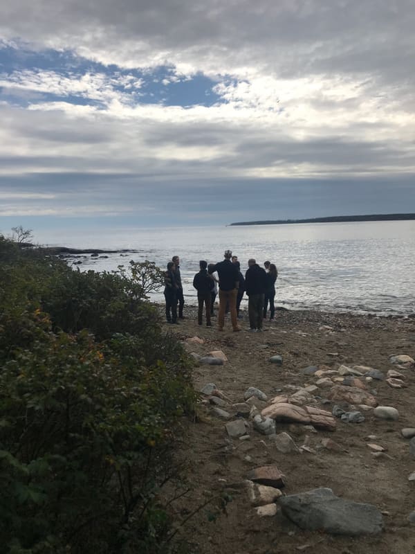 Lab members exploring the rocky Maine shoreline