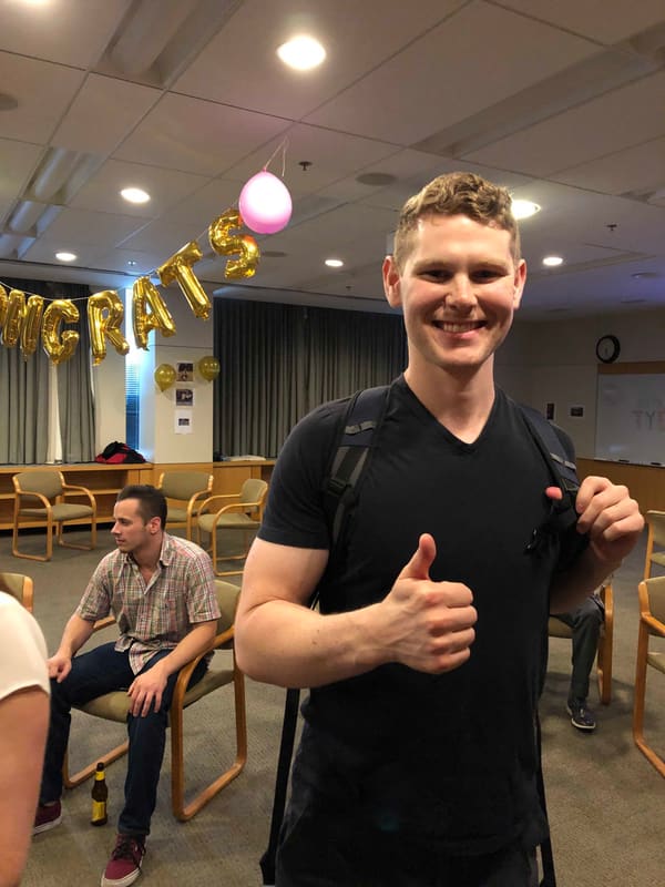 Blake celebrating after his thesis defense