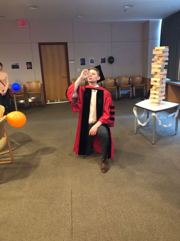 Blake celebrating in his graduation gown