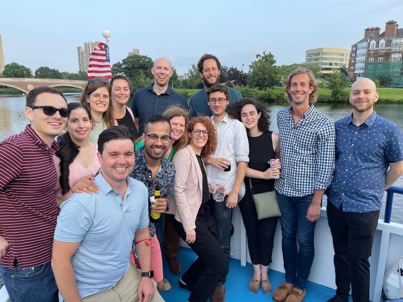 Churchman Lab group portrait beside the Charles River