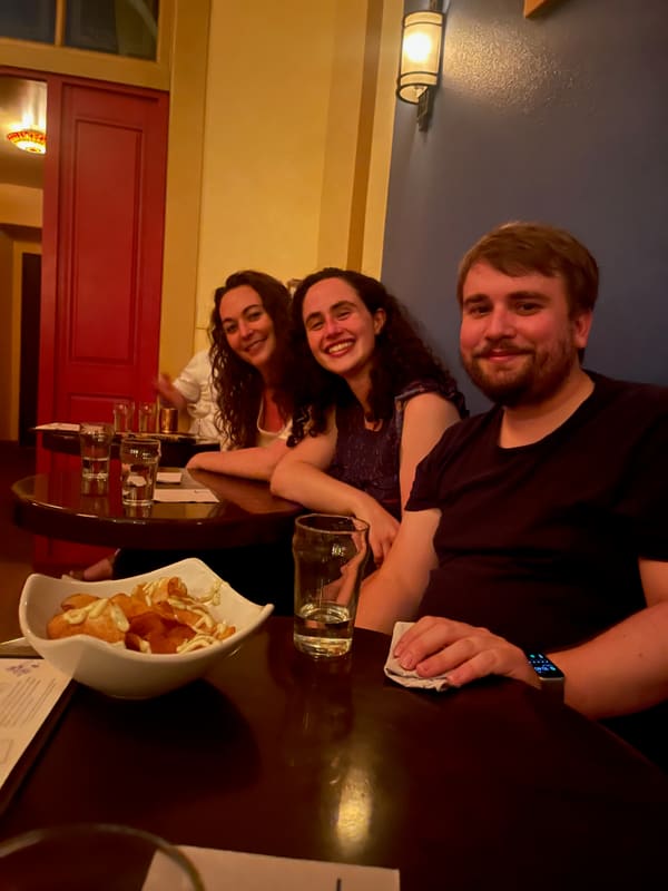 Churchman Lab friends gathered around a table after the Keystone meeting