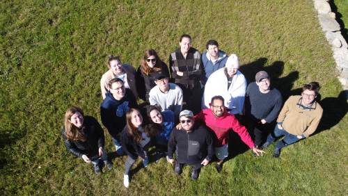 Churchman Lab group looking up at a drone camera