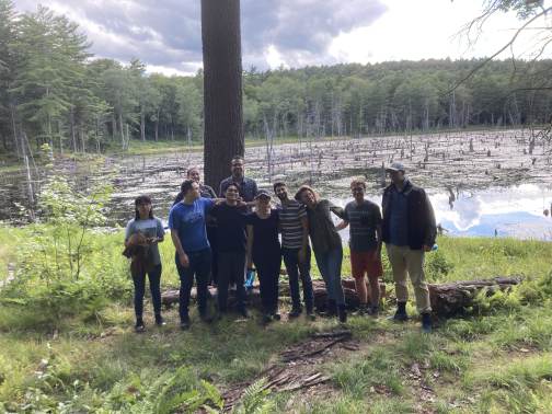 Churchman Lab group beside a woodland pond