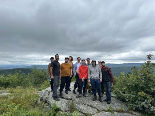 Lab members gathered at a mountain overlook