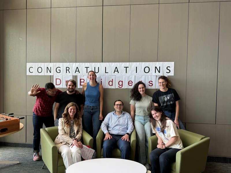 A playful group portrait during Jake’s defense celebration