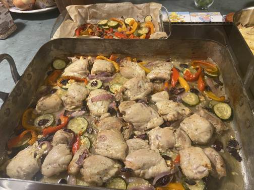 A shared retreat dinner roasting in the farmhouse kitchen
