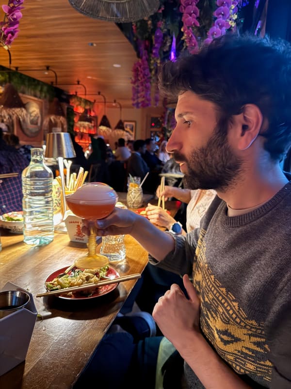 A Churchman Lab member raising a drink at the candidate dinner