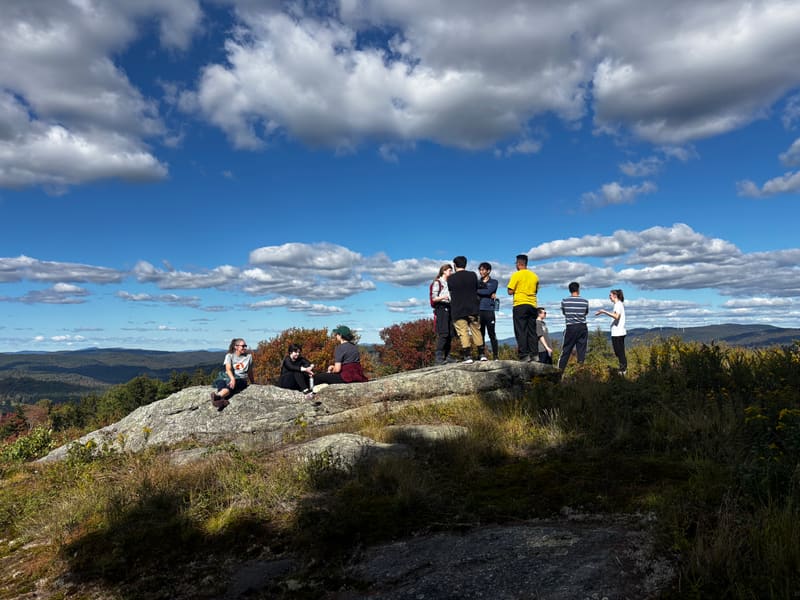 Lab members gathered on a rocky hilltop during the retreat hike